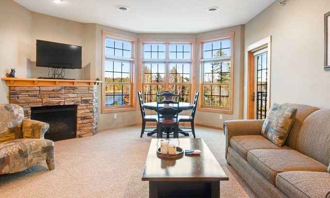 Three Lakes Condo | Lake-view condo with balcony, gas fireplace, indoor pool, hot tubs, & gym
