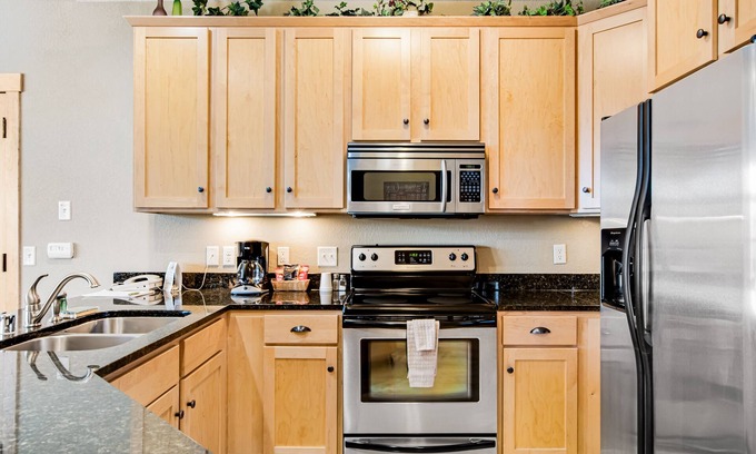 Three Lakes Condo | Lake-view condo with pool and hot tub access, jetted tub, firepit, and a balcony