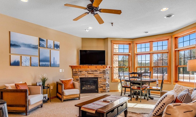 Three Lakes Condo | Lake-view condo with patio, fireplace, hot tubs, pools, firepit, gym, golf & W/D
