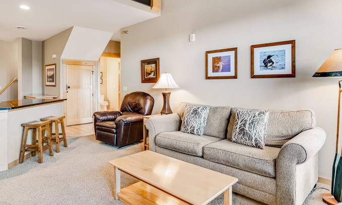 Three Lakes Condo | Lake-view condo with fireplace, loft, washer/dryer, pools, hot tubs, & firepit