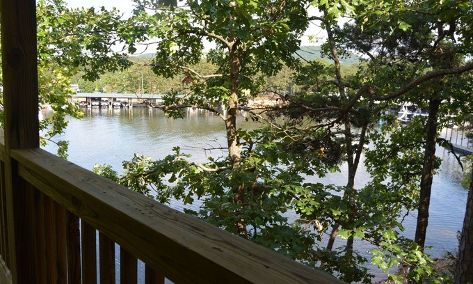 Mount Ida Cottage | Lake view two bedroom, two bath log-sided, luxury Harbor North loft cottage with hot tub overlooking Lake Ouachita. by RedAwning