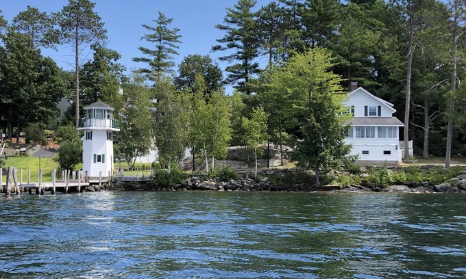 Laconia Cottage | Lakefront Cottage with Lighthouse and Dock on Lake Winnipesaukee