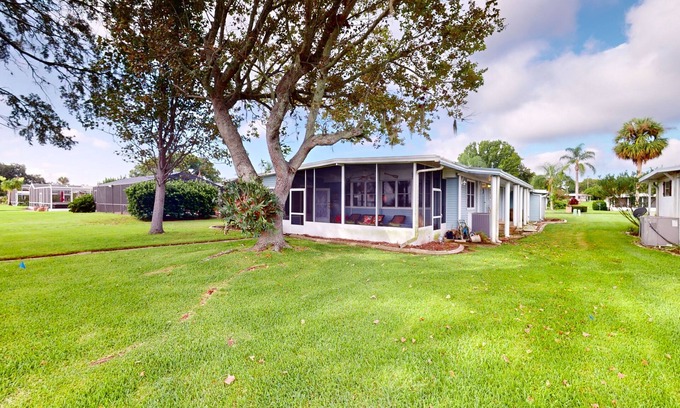 Leesburg House | Lakefront home with al fresco dining, dock, office, expansive interior, & W/D
