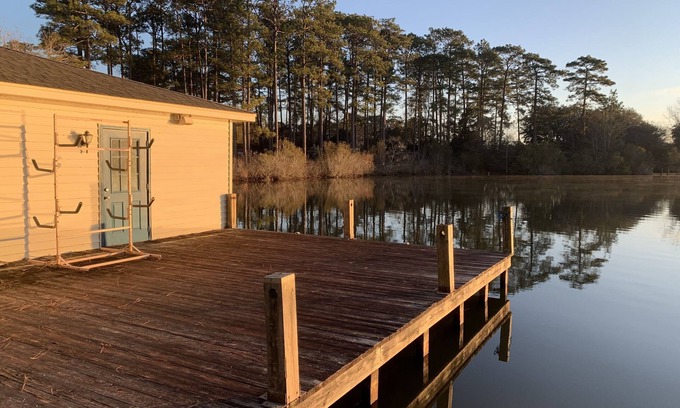 Hattiesburg House | Lakeside pavilion on private lake with a boathouse, outdoor fireplace, kayaks.