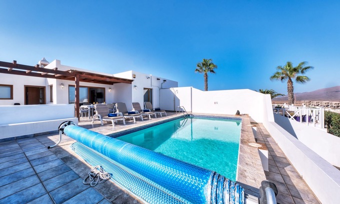 Playa Blanca Ski Chalet | Lava and Sea - Private pool, BBQ and amazing sea views By Lanzarote Vacation Homes