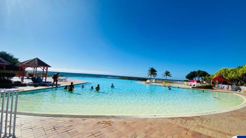 Anse des Rochers Apartment | le Kalinao, Anse des Rochers plage, piscine et cocotiers
