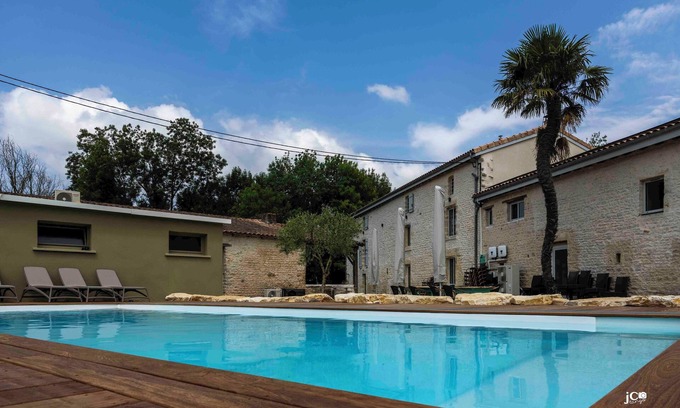 Pamproux Bed & Breakfast | Le Petit Courault: Renovated mill, sleeps 35 comfortably in the heart of nature.