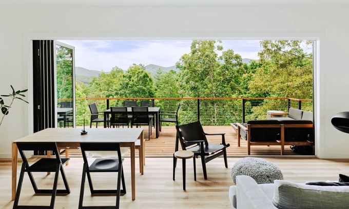 Young Harris Cabin | Letting Geaux is a 4BR/3BA retreat for 8 in the North Georgia mountains. Enjoy fall colors, a private hot tub, ethanol fireplace, game room, firepit, and expansive deck. Stylish and dog-friendly, perfect for autumn escapes and cozy nights.