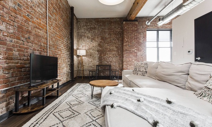 Kansas City Apartment | Loft in the Rivermarket District! Rooftop access and DT KC views. Walk to City Market, local coffee shops, restaurants, shops or hop on the free streetcar just steps away. Minutes from P&L, T-Mobile, Crossroads, Plaza. 10 min drive to stadiums.