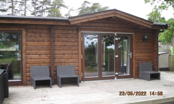 Kenwick Cabin | Log cabin with decked veranda, nestled in Kenwick Park, Louth