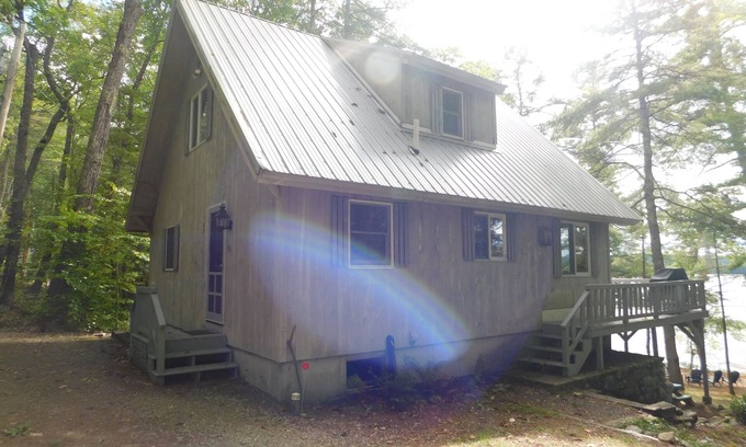 Naples Ski Chalet | Long Lake chalet and guest house with 200' of water frontage and sunset views
