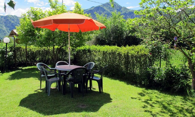 Calceranica al Lago Apartment | Lovely apartment for 5 guests with WIFI, TV, patio, pets allowed, panoramic view and parking