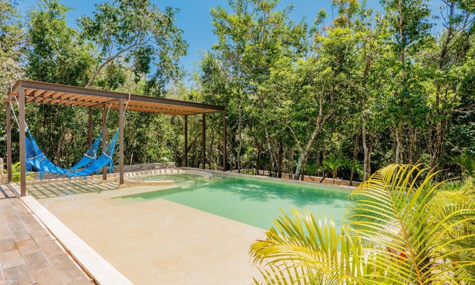 Xpu-Ha Apartment | Lower level apartment with high-speed internet pool, gym, & tennis courts