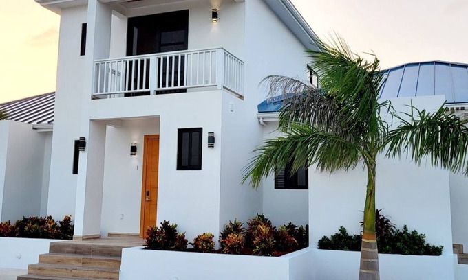Leeward Settlement Apartment | Lush 2-Story Villa, Poolside Bliss Near Beach