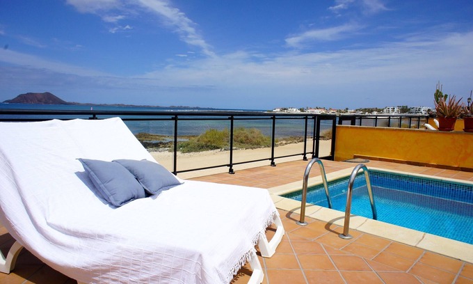 Corralejo Villa | Luxurious beachfront vacation rental home with heated salt water pool