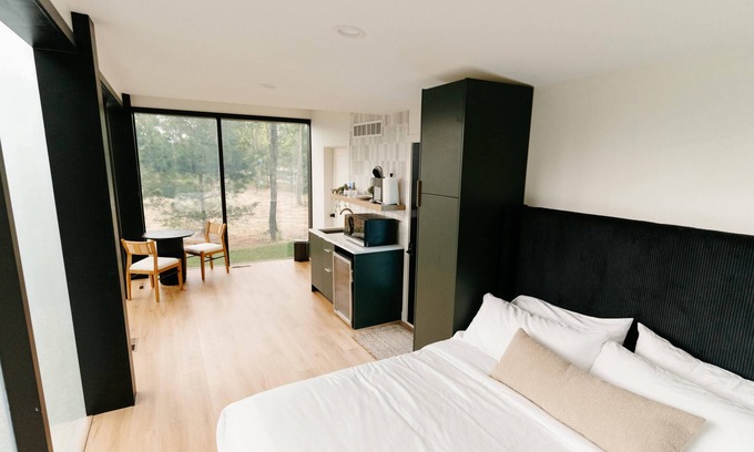 Pepin Cabin | Luxurious mirrored cabin nestled on the Woods & Co Weddings + Events property for the ultimate getaway