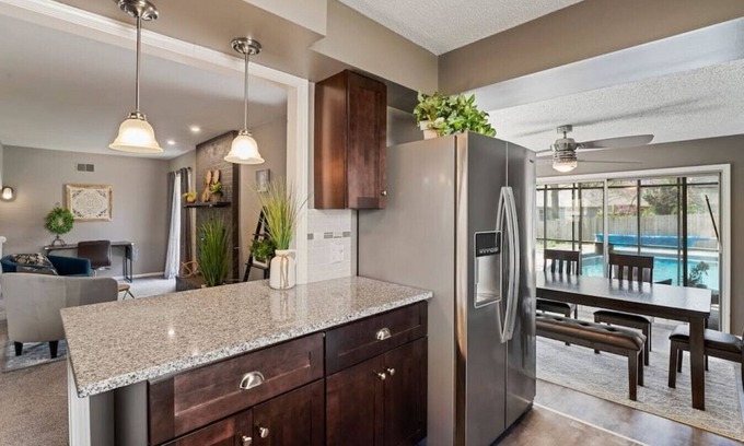 South Kansas City House | Luxurious Poolside Escape on 106th Street: Your Private Oasis in Kansas City