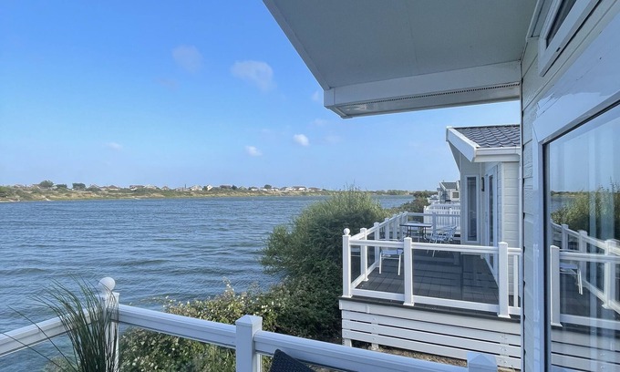 Pagham Cabin | Luxury 3 bedroom waterside lodge, a stones throw from Pagham beach and harbour.