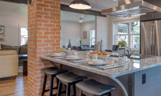 Collister House | Luxury at its Finest | Indulge in Gourmet Kitchen, Spacious Dining Area, Lovely Patio & Plush Beds