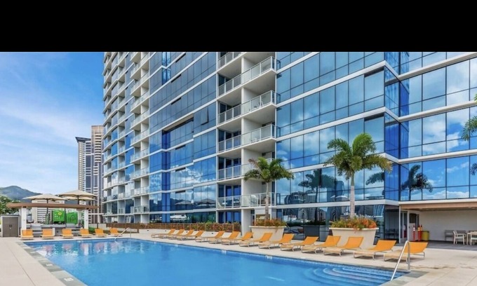 Downtown Honolulu Apartment | Luxury Condo with full view of the Ocean, Lanai, Pool, Hot Tub, Gym & Playground