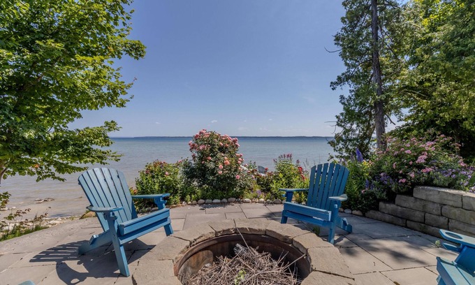 Suttons Bay House | Luxury Lakefront Retreat with Private Beach & Hot Tub