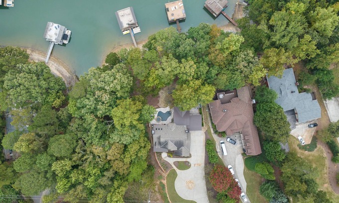 Buford House | Luxury Lakefront retreat. Privacy gate, pool and outdoor kitchen