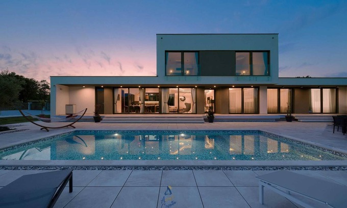 Rakalj Villa | Luxury retreat for 8 guests, with pool surrounded by olive trees