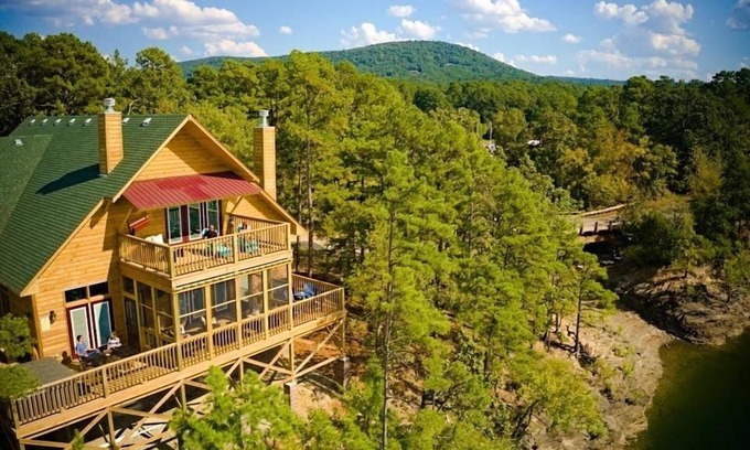 Mount Ida Cottage | Magnificent Four Bedroom, Two 1/2 Bath luxury, log-sided Harbor North cottage with incredible views of Lake Ouachita. by RedAwning