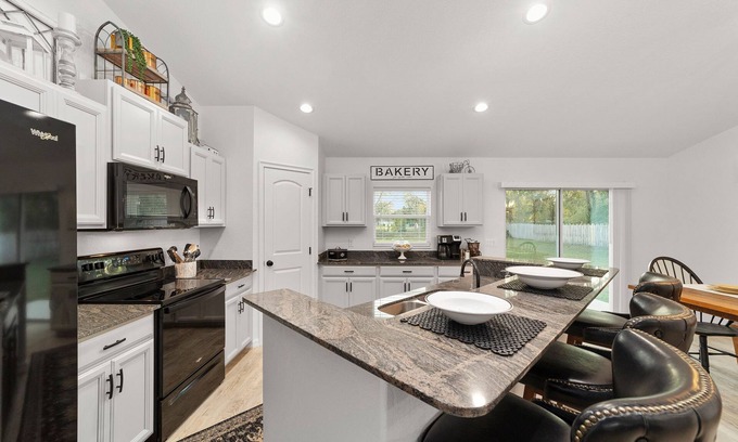 Candler House | Mexican themed LARGE home walking distance to private lake! Fish swim and play!!