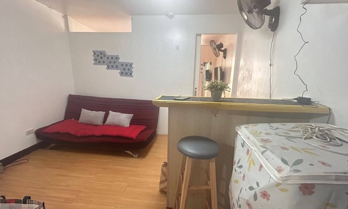 Imus Condo | Minimalist Room in Imus Condo with netflix and round-clock Security