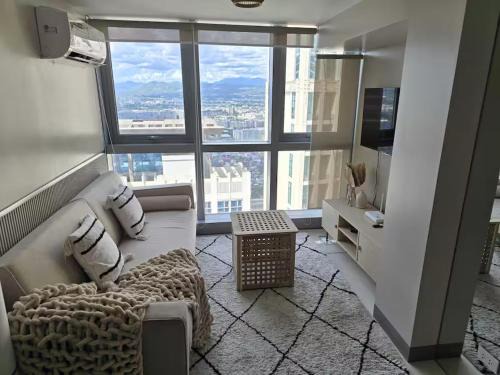 Bagumbayan Apartment | Modern Comfort & Snap Worthy with Pool, Gym & More