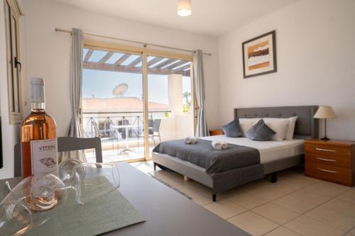 Peyia Town Apartment | Modern Studio with Pool and Balcony Hillside and Sea Views For Business or Leisure Travellers