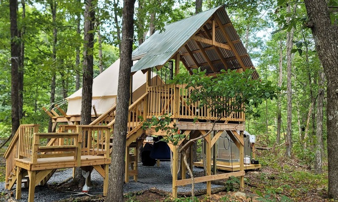 Denton House | Mountain Bell tent Tree house providing views of surrounding mountains and lake.