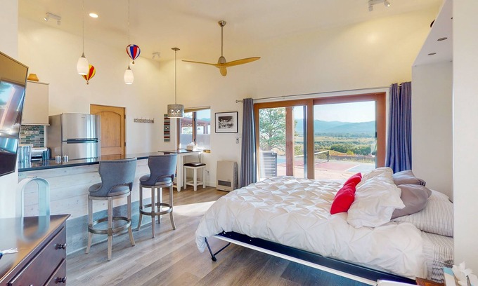 Taos Cottage | Mountain-view casita with hot tub, pickeball court, walking labyrinth & orchard