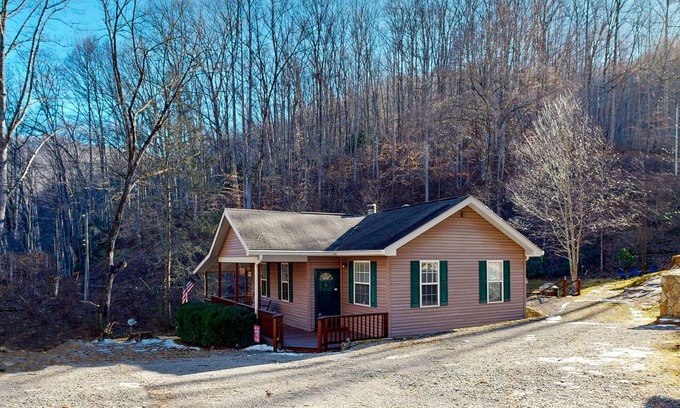 Sylva House | Mountain view home with a fireplace with beautiful view of the creek