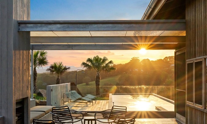 Myocum House | Myocum Ridge Farm - A winding driveway, cows, blue skies, manicured lawns, glittering pool