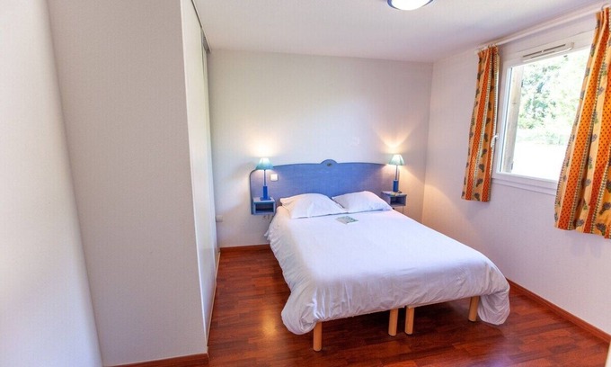 Cassen Apartment | Nature's Retreat: Indoor & Outdoor Pools with Solarium & Playground