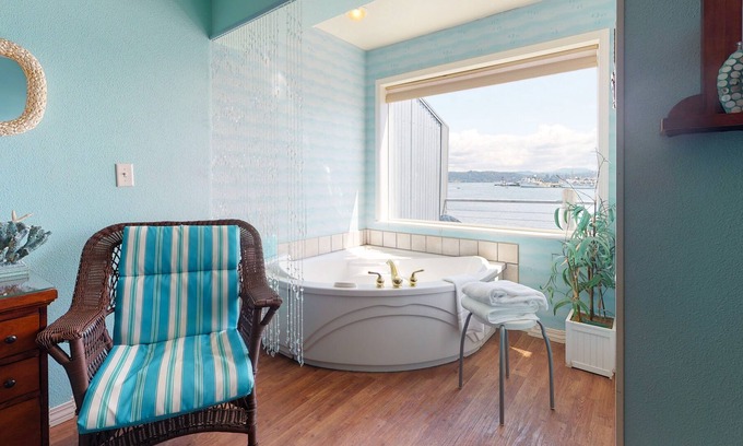 Historic Bayfront Apartment | New listing! Bayfront studio w/ jetted tub, fireplace & balcony - near the beach
