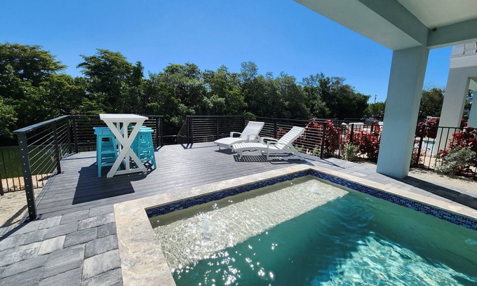 Cortez House | NEW! Saltwater Serenity .08 Miles to AMI, Canal Front w/Heated Pool!