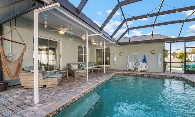 Palma Sola House | ⚓New - Waterfall Retreat! Private heated pool/spa Min from AMI⚓