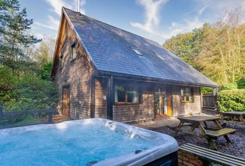 Farley House | Norbury, woodland lodge with hot tub for 12