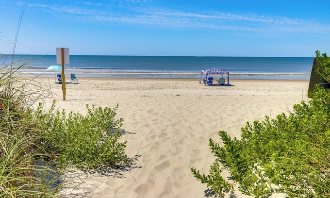 Yaupon Beach Apartment | Oak Island Condo w/Ocean View: Steps to Beach!