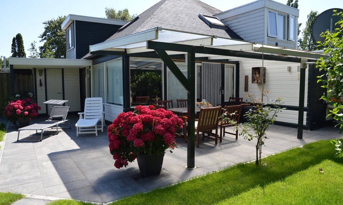 Stavenisse House | Oasis of relaxation - Het Puppenhuisje with communal pool,