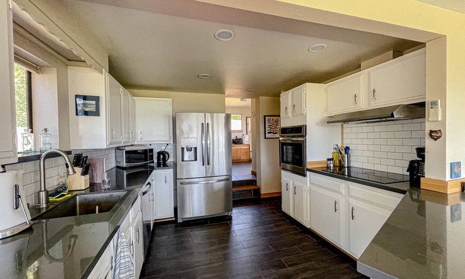 Austin House | Ocean view home with incredible setting & deck - walk to the beach, near town