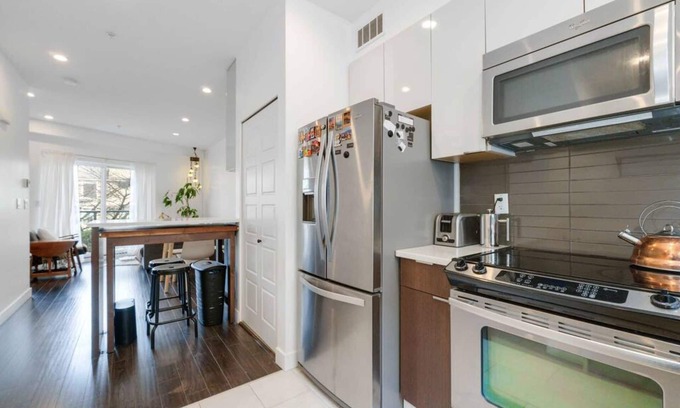 Grandview-Woodland House | Oceanside oasis + mountain view w/private rooftop