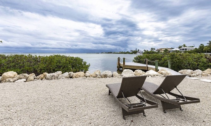 Breezeswept Beach Estates House | Oceanview Cottage: Embrace Island Living with Sandy Toes and Breathtaking Open Water Views!