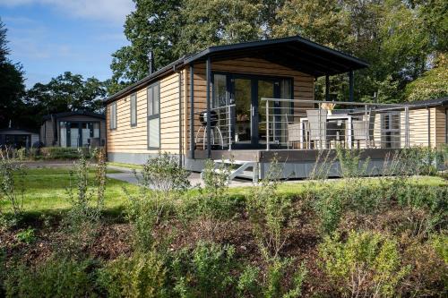 Gronenberg House | Ostseecamp Lübecker Bucht Haus "Morgensonne" mit überdachter Veranda