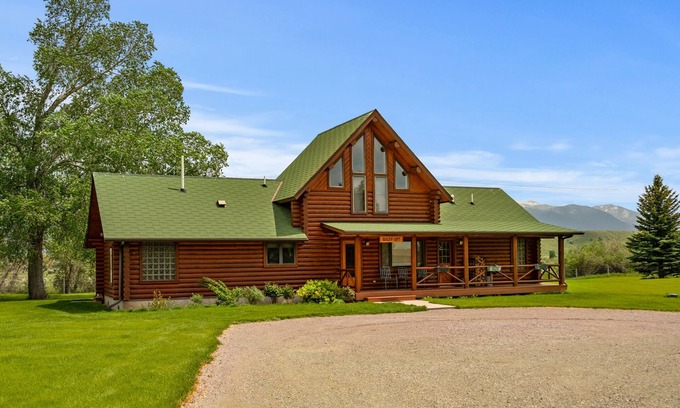 Ennis House | Our ultimate luxury Montana log cabin. Special highlights include a vaulted ceiling, an expansive rock fireplace and spectacular views of the Madison Range.
