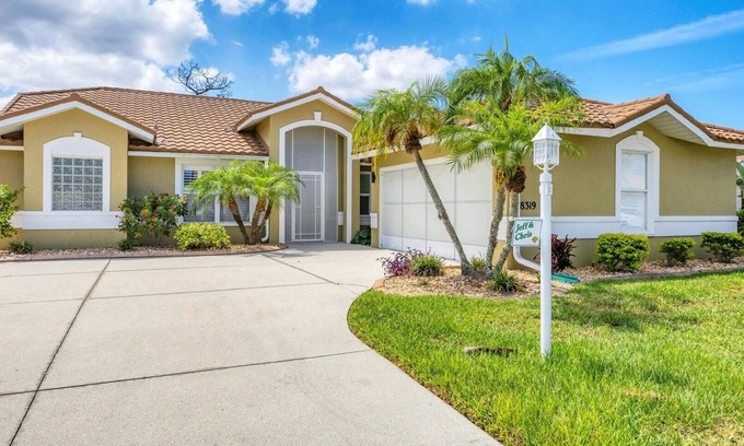 Englewood South House | Oyster Creek Beautiful home in golfing community with water and preserve views, golf cart included
