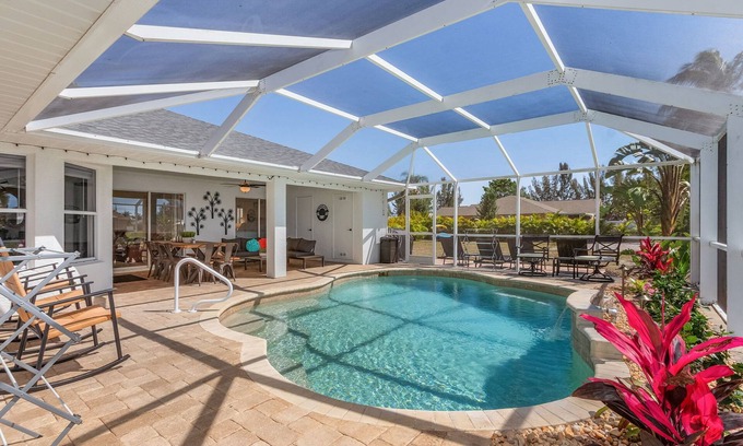 Cape Coral Villa | PARADISE COVE- Spacious Canal Home with htd saltwater Pool! Sleeps 13!